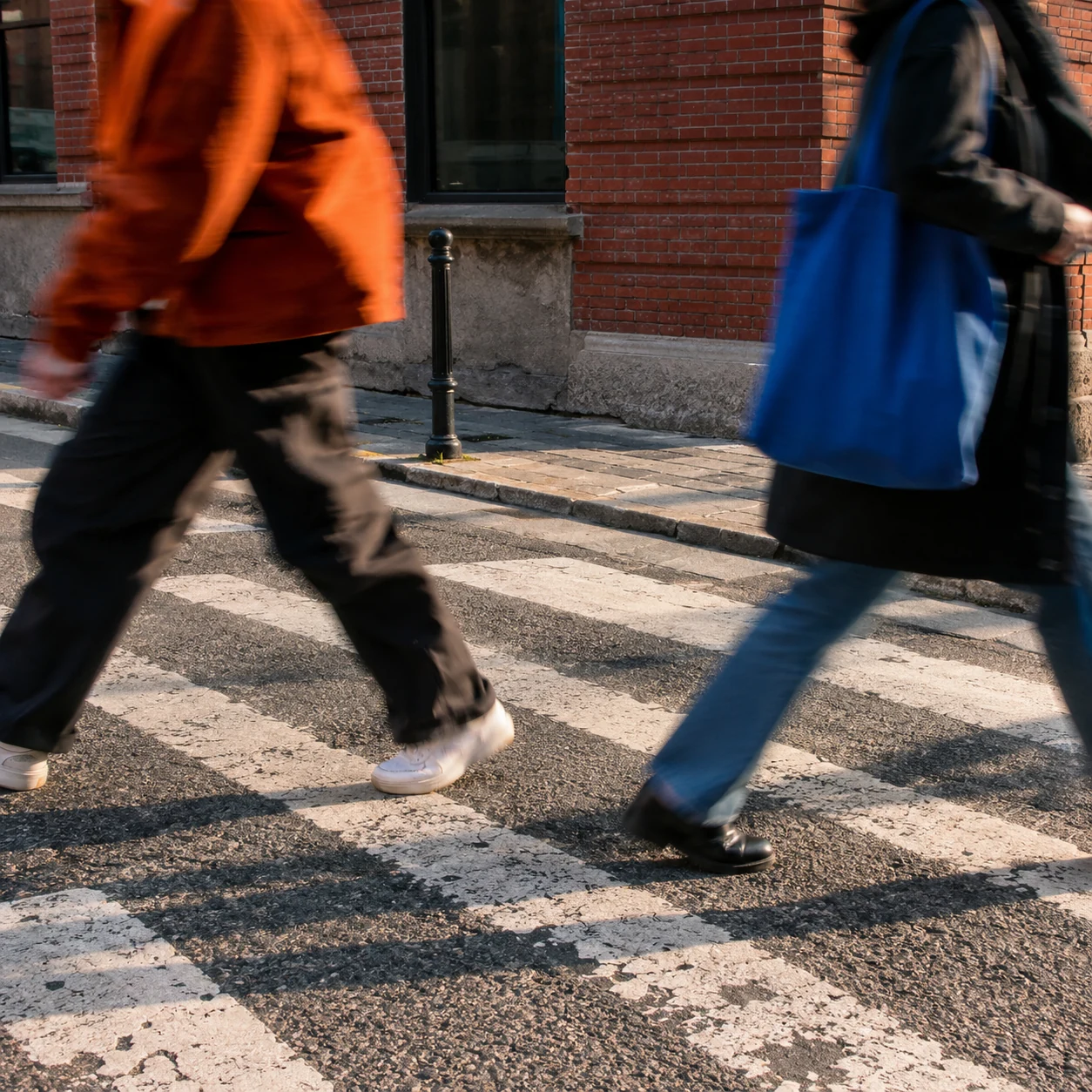 A street scene with passing figures and natural motion blur